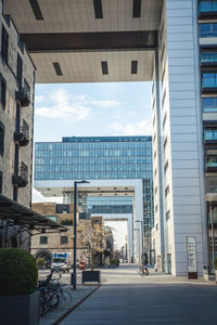 Street amidst buildings against sky in city