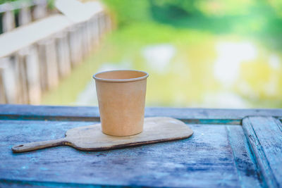 Close-up of coffee cup on table