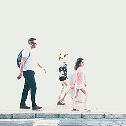 Full length of woman standing by railing