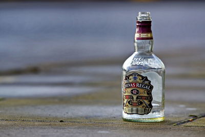 Close-up of glass bottle on table