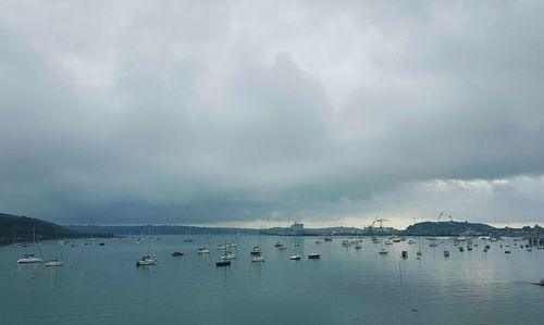 Scenic view of sea against storm clouds