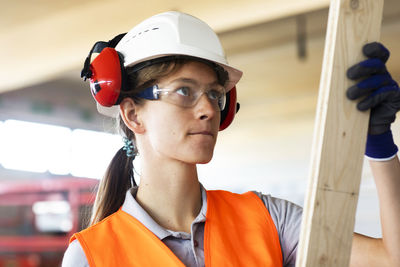 Young woman working in a workshop as artisan manual worker