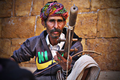 Portrait of man sitting outdoors