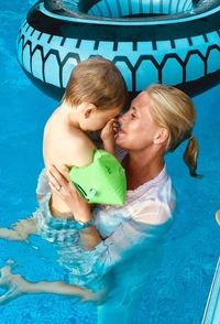 High angle view of woman swimming in pool