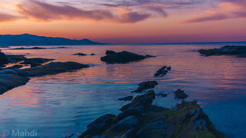 Scenic view of sea against sky at sunset