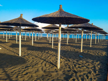 Gazebo on beach against sky