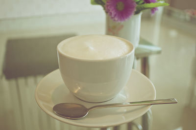 Close-up of coffee cup on table