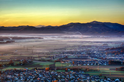 High angle view of city at sunset