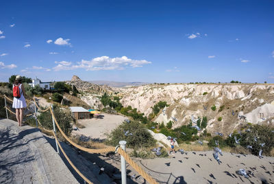 High angle view of people on mountain against sky