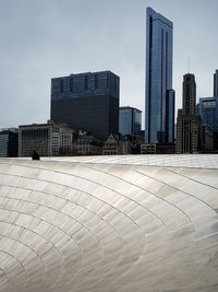 Modern buildings in city against sky