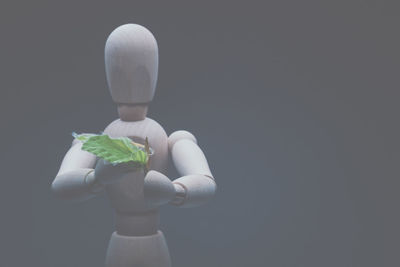 Man holding flower against blurred background