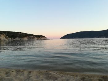 Scenic view of sea against clear sky during sunset