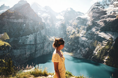 Woman standing on mountain against mountains