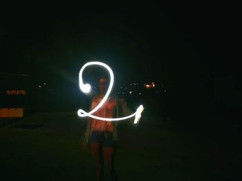 People playing guitar at night
