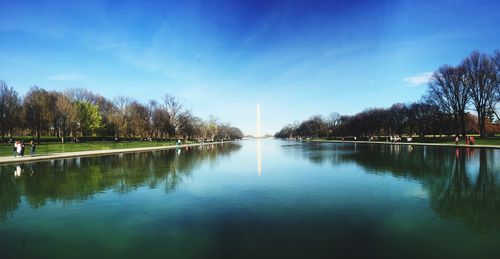 Scenic view of lake against blue sky