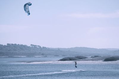 Tourists flying over sea