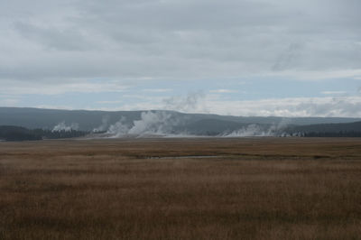 Scenic view of landscape against cloudy sky