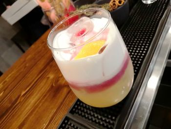 High angle view of drink in glass on table