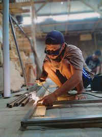 A welder man working at workshop