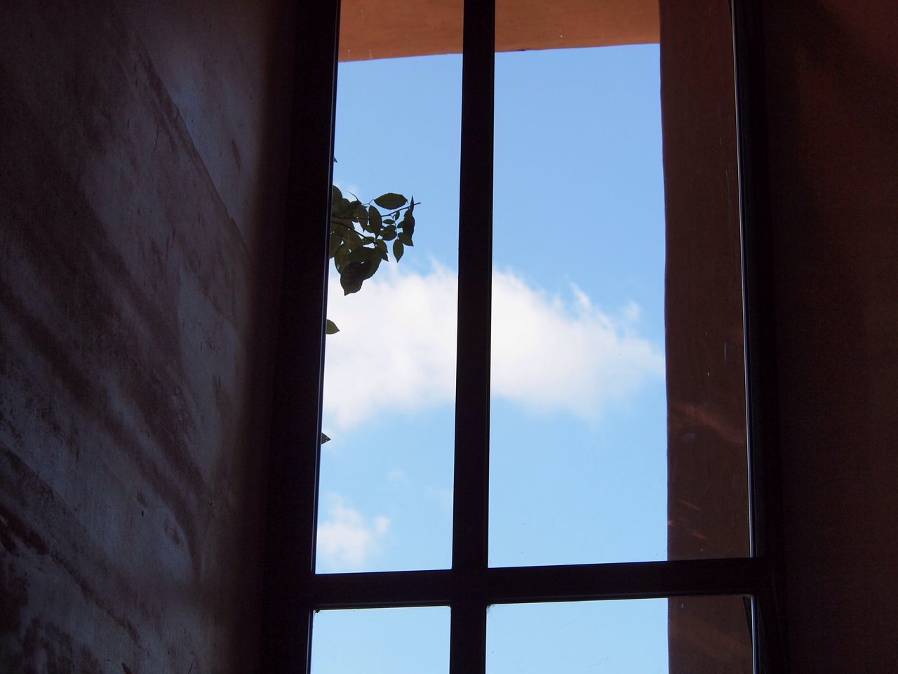 window, architecture, built structure, indoors, sky, low angle view, building exterior, house, glass - material, day, door, no people, wall - building feature, cloud - sky, cloud, building, transparent, sunlight, wall, old