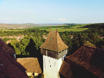 Panoramic view of roof and building against sky