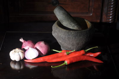 Close-up of red chili peppers on floor