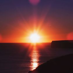 Scenic view of sea against sky at sunset