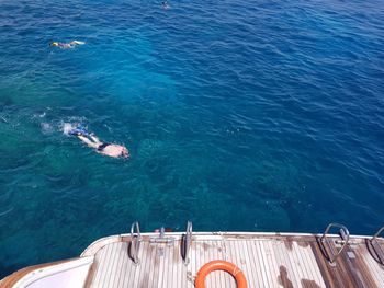 High angle view of man swimming in sea