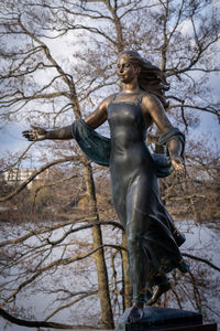 Low angle view of statue against sky