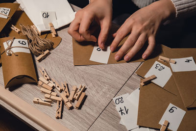 Cropped hands of man working on table