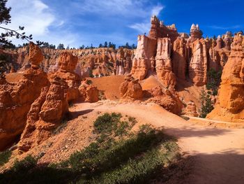 Panoramic view of rock formations against sky