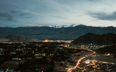 High angle view of illuminated buildings in city against sky