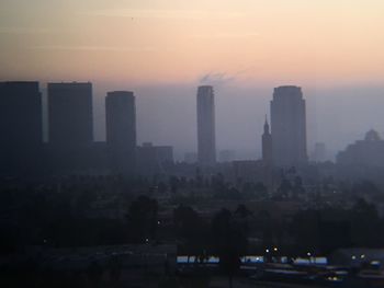 Cityscape against sky during sunset