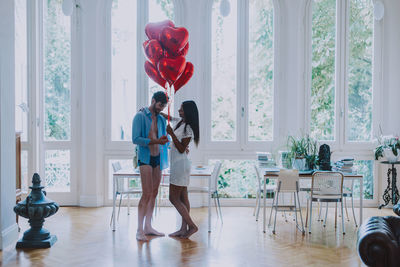 Women standing in corridor at home