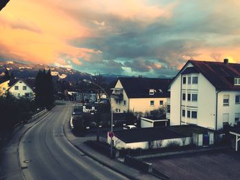 Road against cloudy sky at sunset