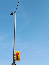 Low angle view of street light against sky