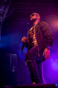 Low angle view of man on stage during music concert