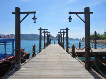 Pier amidst sea against sky