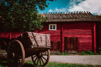 Exterior of house by building against sky