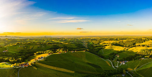 Gorgeous sunset over beautiful green vineyards. aerial panorama sunset over austrian styria