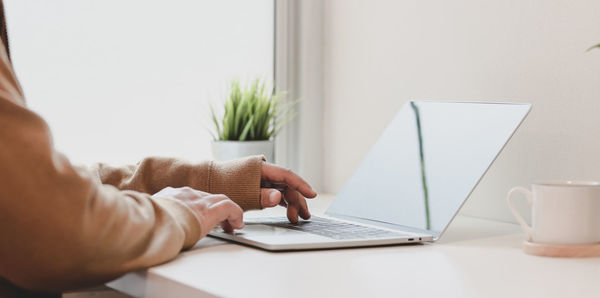 Man using laptop on table