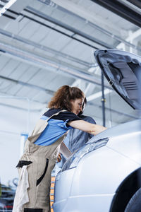 Side view of woman in car