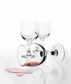 Close-up of wineglass against white background