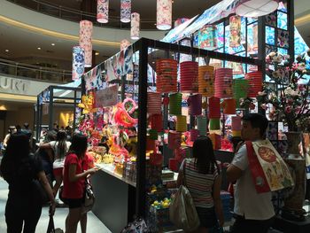 People at multi colored store in city