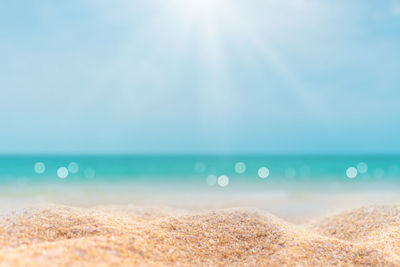 Scenic view of sea against sky on sunny day