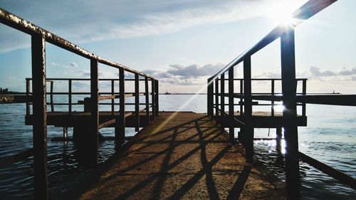 Pier over sea against sky