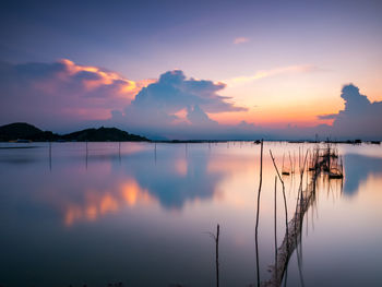 Scenic view of lake against sky during sunset