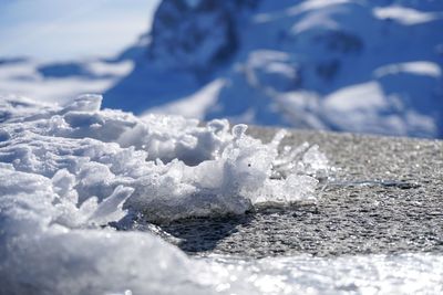 Scenic view of snow covered land and sea