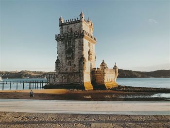 Scenic view of belem tower, lisbon, against the sky in a warm afternoon 