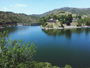 Scenic view of lake and mountains against sky